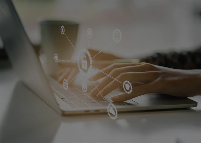 Man typing on laptop